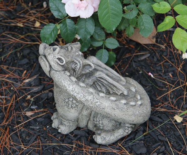 Lil Dragon treats biting tail sculpture garden statue made of cement